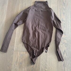 Brown turtleneck bodysuit